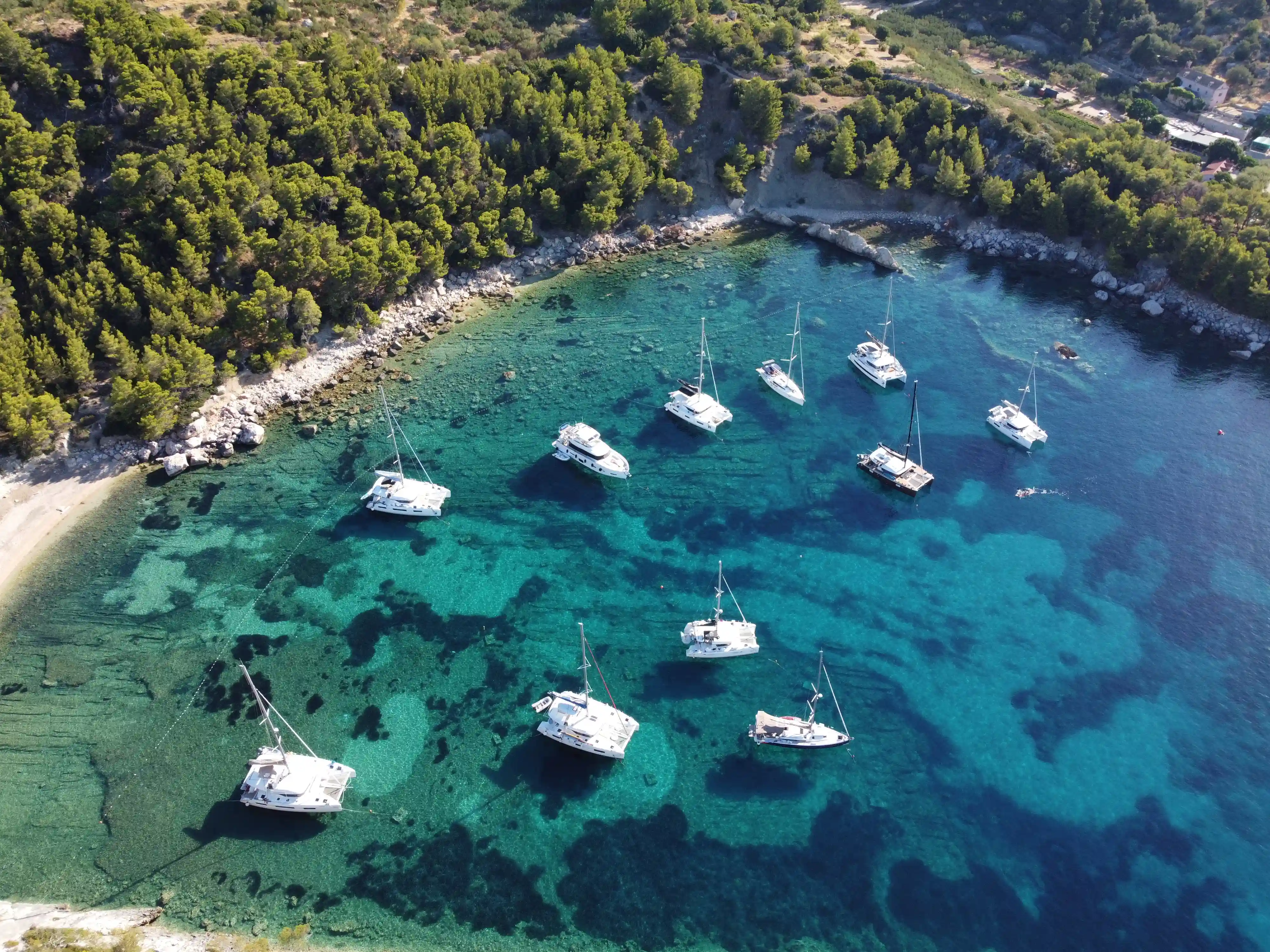 Eleven sailboats in the cove, Croatia fleet, Catamarans and Yachts, Beautiful cristal seas