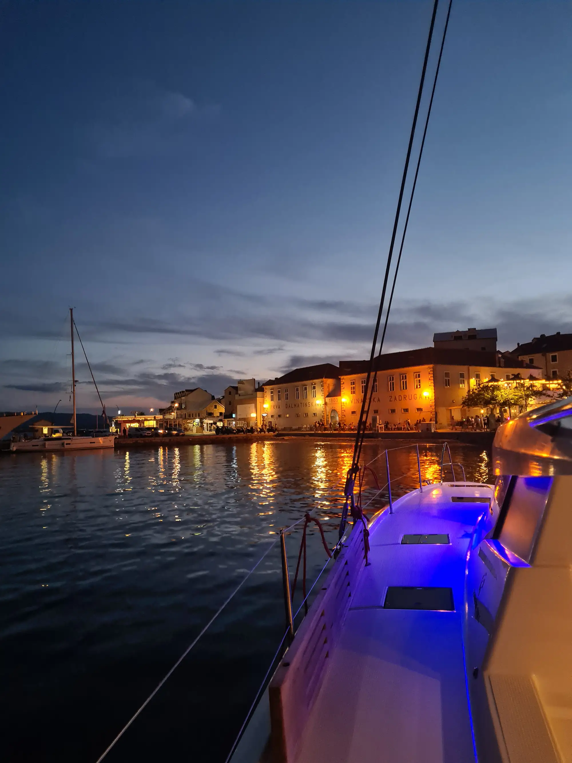 Sunset sailing to island town