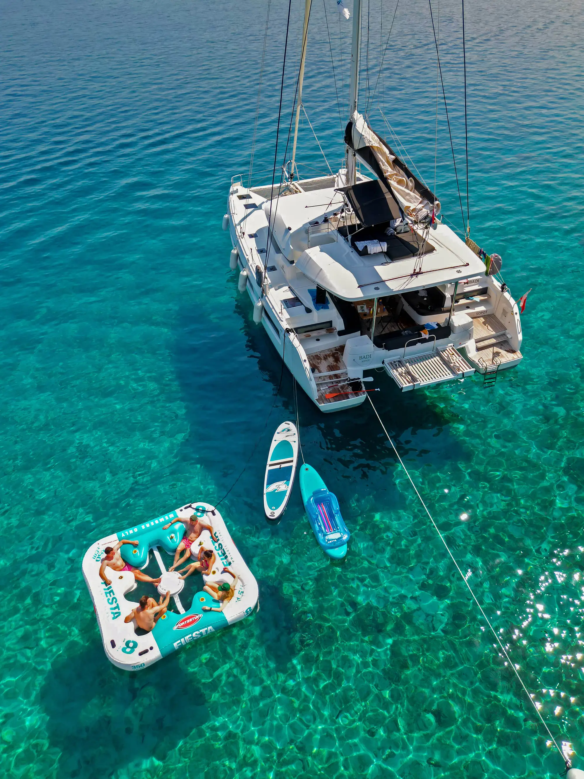 Enjoying the swimming near catamaran