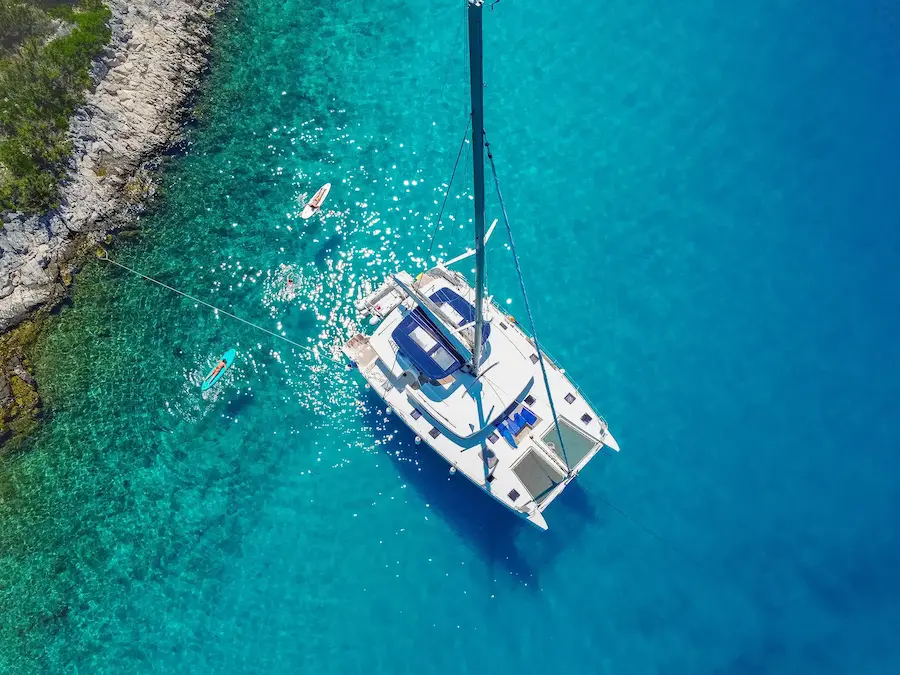 People swimming near the catamaran in the Adriatic Sea