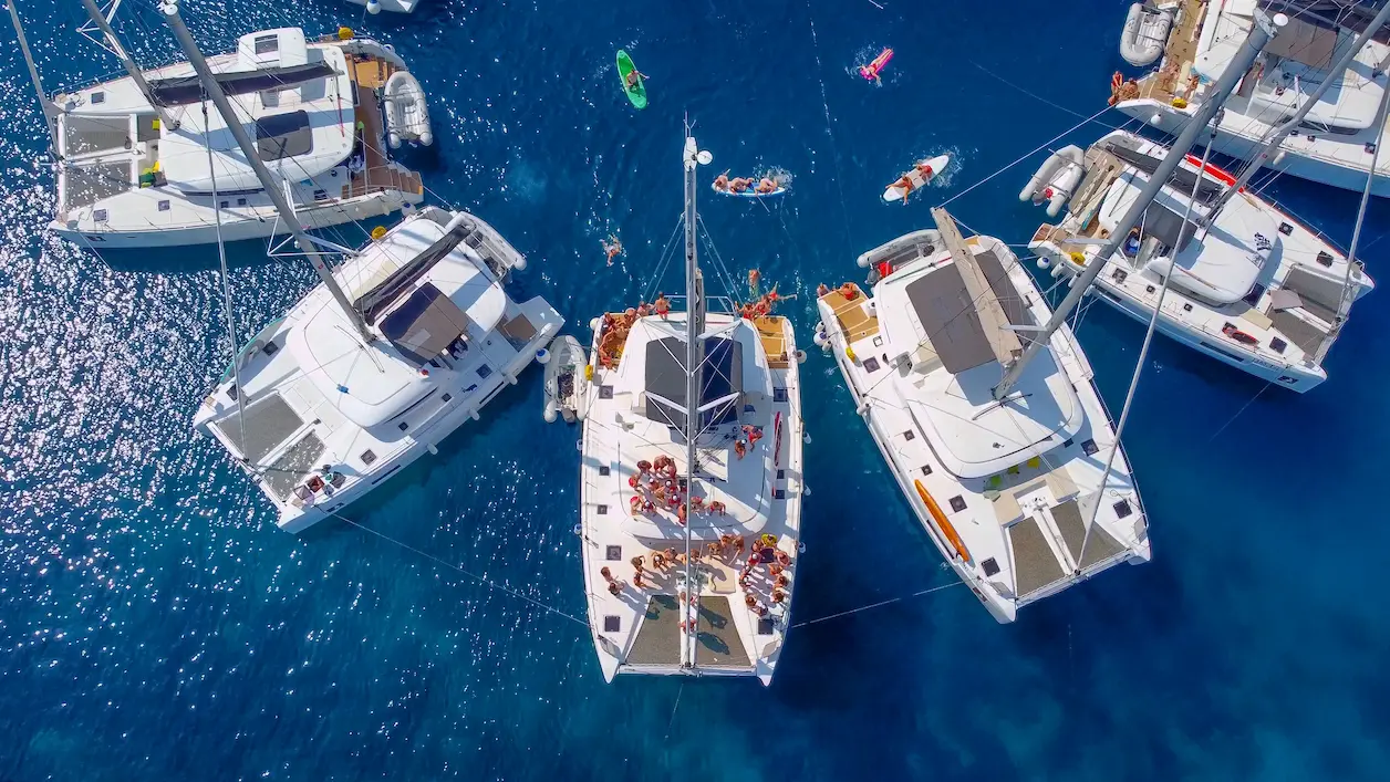 People partying on catamaran, catamaran fleet party