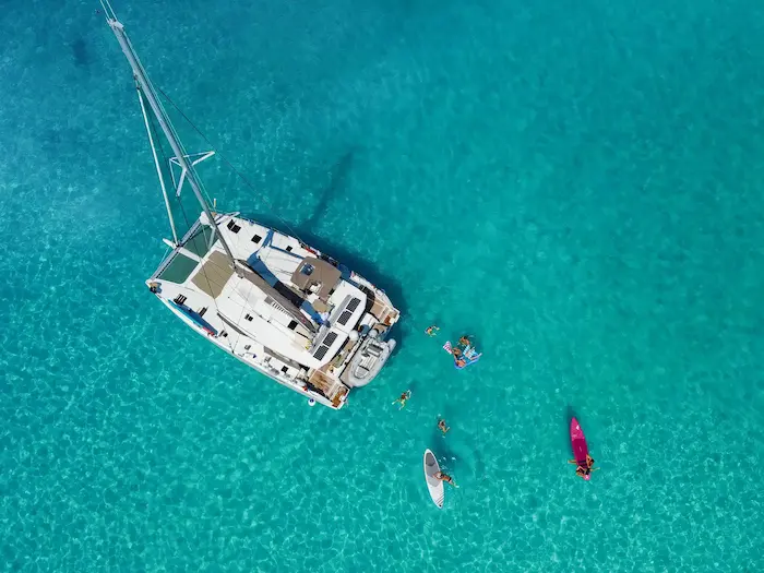 Guests swimming near Catamaran