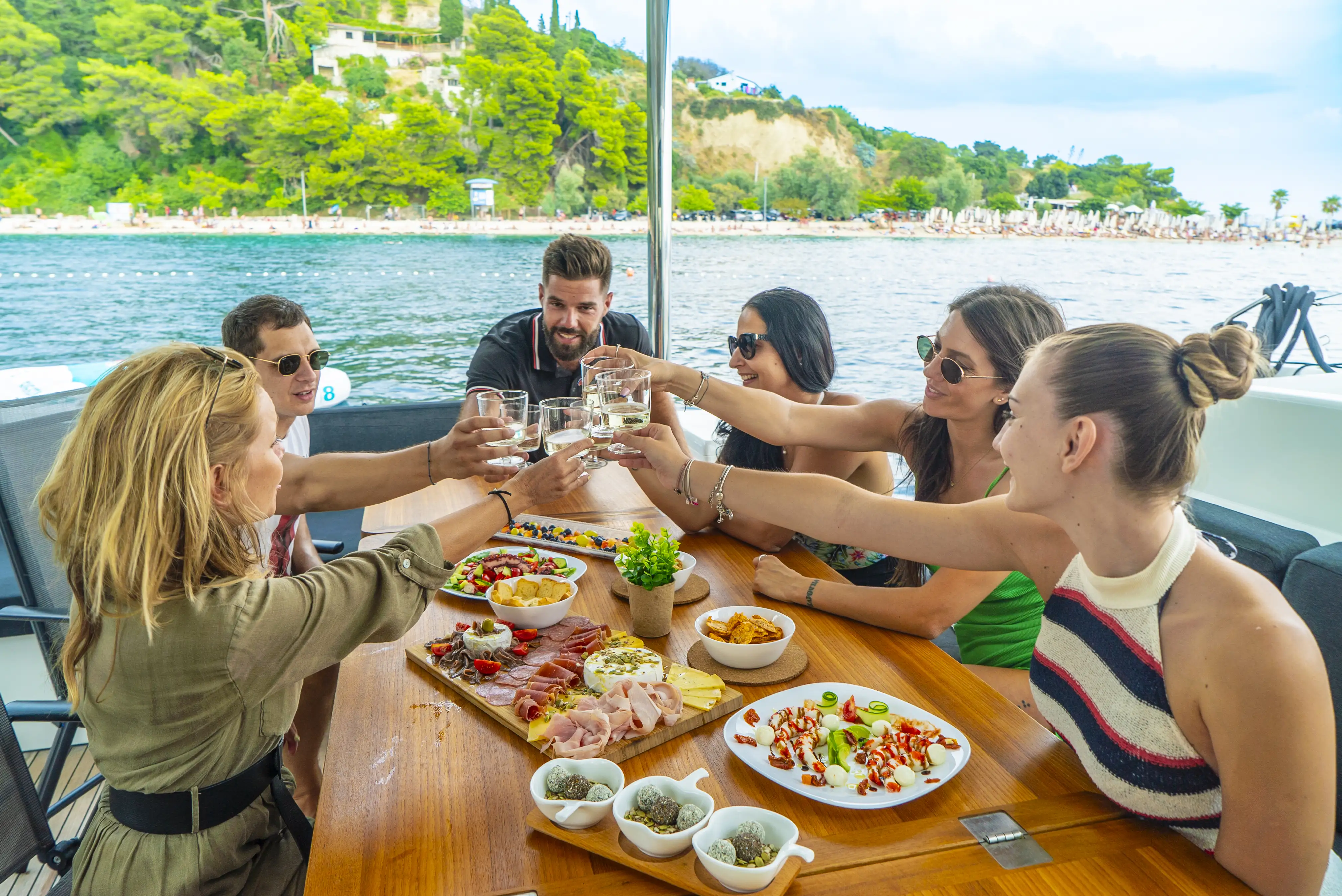People enjoying the local cuisine on the yacht in dalmatian coast